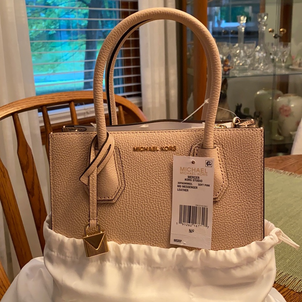 Brand new, never used soft pink Michael Kors bag.
